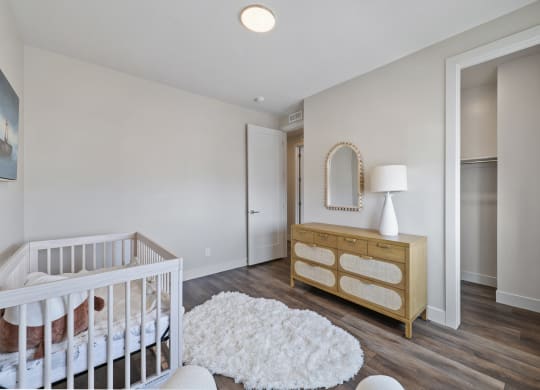 Furnished bedroom with crib