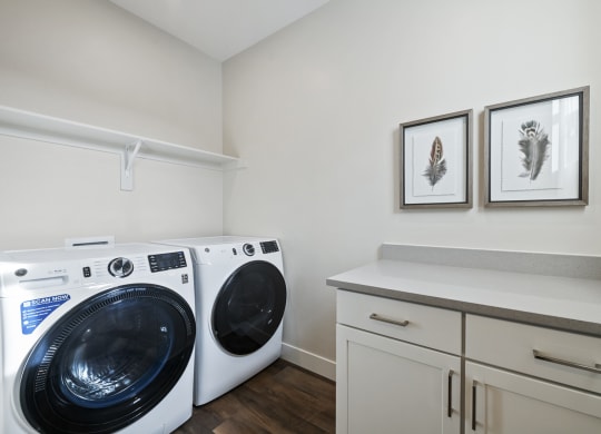 Laundry room with cabinets and counterspace