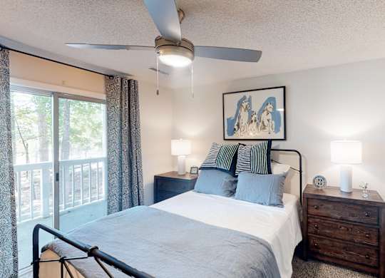 A bedroom with a bed, nightstand, and a ceiling fan at Inverness Cliffs, Alabama, 35242