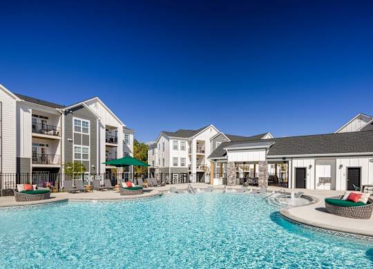A swimming pool in front of apartment buildings.at 198 Milltown Apartments, North Carolina, 27215