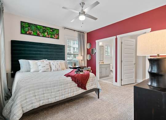 Bedroom with ceiling fan at 198 Milltown Apartments, Burlington, NC