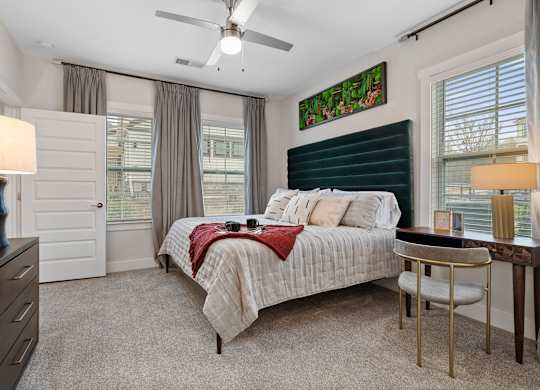 A bedroom with a bed, desk, and chair.at 198 Milltown Apartments, Burlington, 27215  