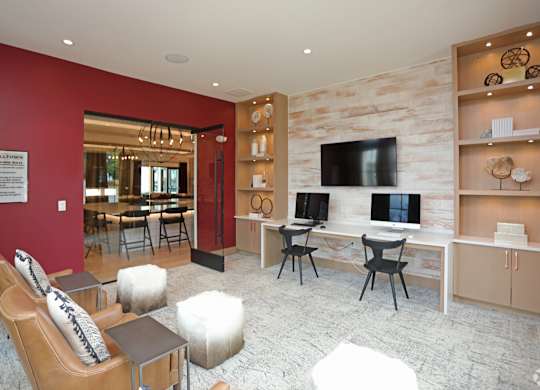 A living room with a red wall and a white couch.at 198 Milltown Apartments, Burlington North Carolina  