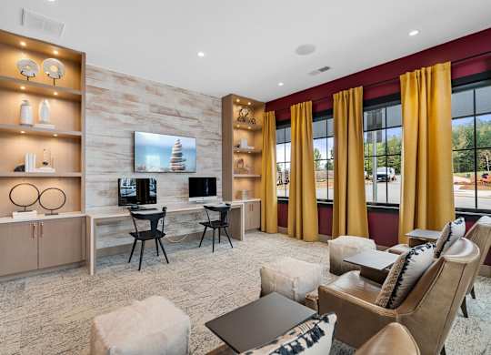 A living room with a television, chairs, and a table.at 198 Milltown Apartments, Burlington, 27215  