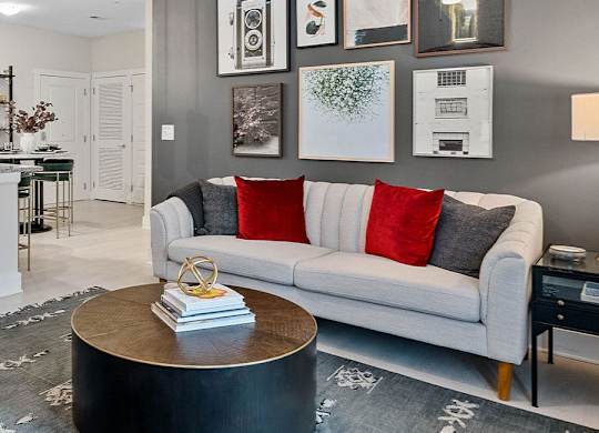 A modern living room with a grey couch and a coffee table.at 198 Milltown Apartments, Burlington, NC 27215  