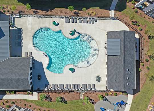 An aerial view of a house with a blue pool in the backyard.at 198 Milltown Apartments, Burlington  