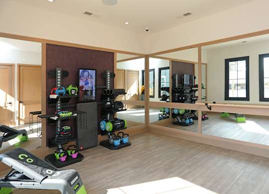 A room with a treadmill and exercise equipment.at 198 Milltown Apartments, Burlington, NC  