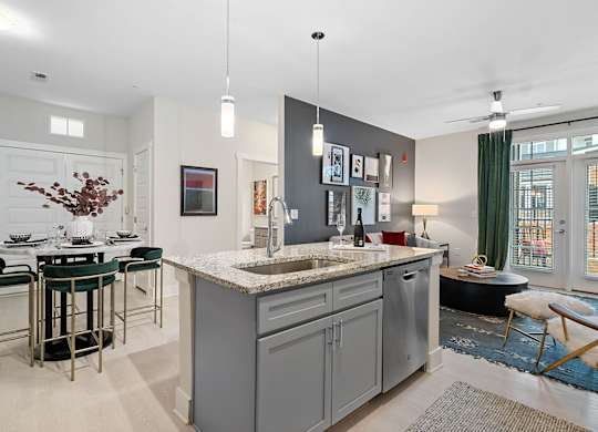 A modern kitchen with a large island and bar stools.at 198 Milltown Apartments, North Carolina  