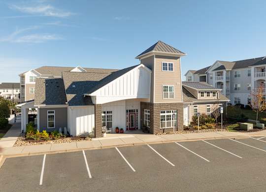A large building with a parking lot in front of it. at Concord Ridge Apartments, Concord, North Carolina