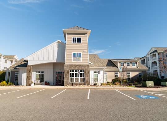 A large building with a parking lot in front of it. at Concord Ridge Apartments, Concord, NC, 28027