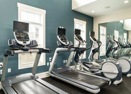 A row of treadmills in a gym. at Concord Ridge Apartments, Concord, NC, 28027