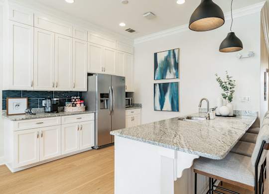 A kitchen with a marble countertop and a refrigerator. at Concord Ridge Apartments, Concord, NC, 28027