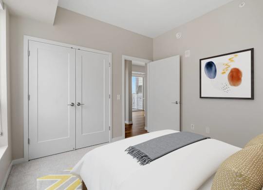 private bedroom with French door closets at The Hallon Apartments, Hopkins, MN