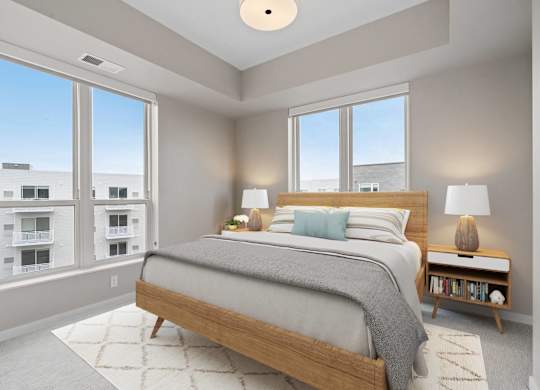 bedroom with queen bed and floor to ceiling windows at The Hallon Apartments, Hopkins, Minnesota