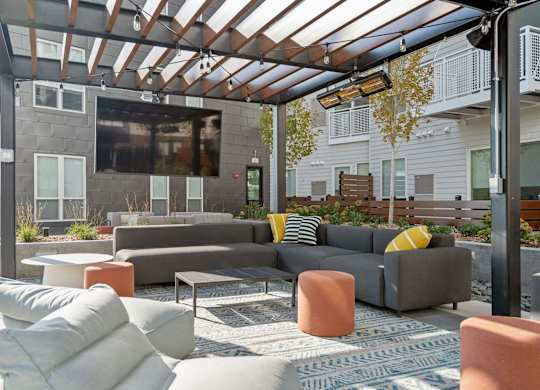Outdoor shaded TV lounge at The Hallon Apartments, Hopkins, MN, 55343