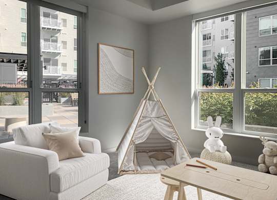 a living room with a teepee and a couch and a coffee table