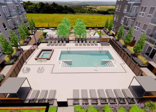 an aerial view of an apartment complex with a swimming pool