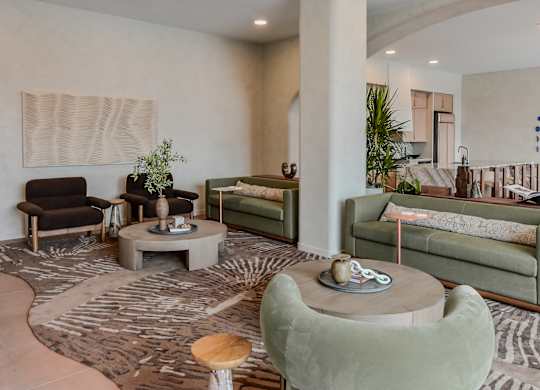 A living room with a green couch and a wooden coffee table.