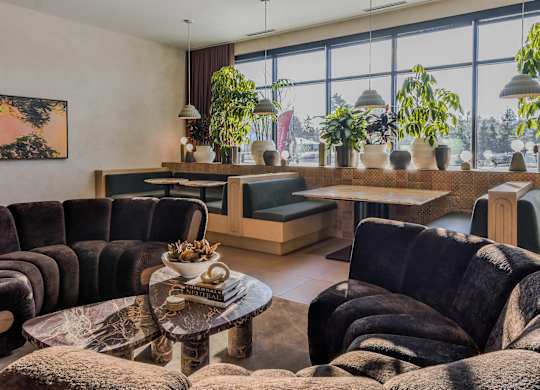 A living room with a large couch and a coffee table.