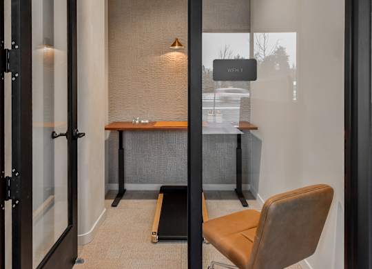 A room with a desk and a chair.