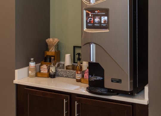 a coffee maker on a counter in a hotel room