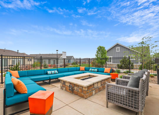 gather around the fire pit at the enclave at woodbridge apartments in sugar land, tx