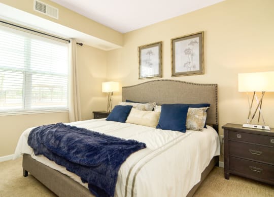 one of the bedrooms at the enclave at woodbridge apartments in sugar land, tx