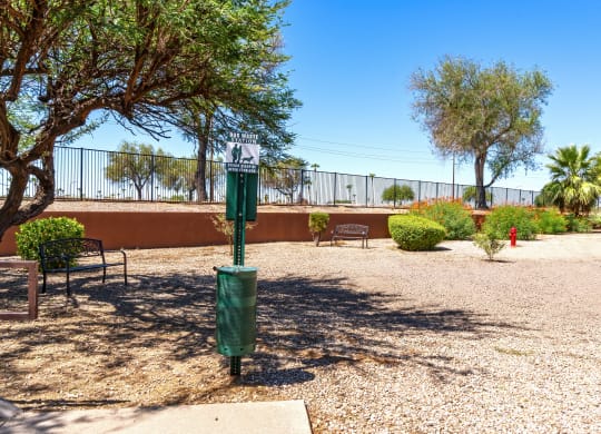 a parking lot with benches and a street sign