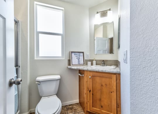an empty bathroom with a toilet and a sink