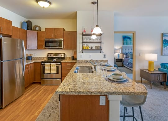 Kitchen with Island at The Enclave Luxury Apartments