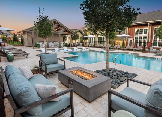 fire pit by the pool at the cottages