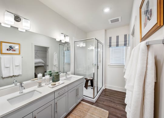 Bathroom with glass shower at the cottages