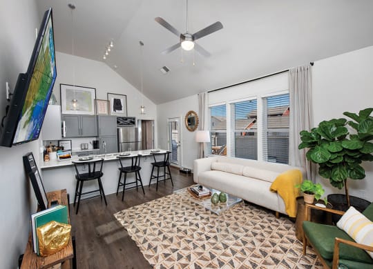living room with kitchen view at the cottages