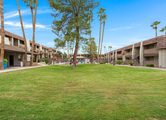 Verde Apartments buildings with grass in front. Tucson, AZ, 85719