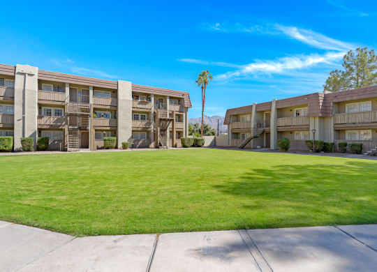 Property Exterior with Lawn at Verde Apartments in Tucson, AZ, 85719