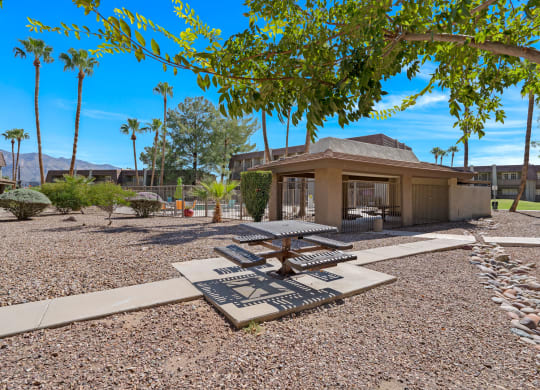 a view of a courtyard with trees and a building at Verde Apartments