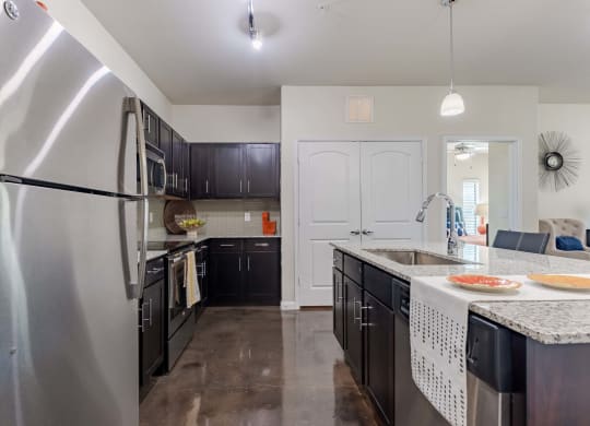 Kitchen Island with Stainless Steel Appliances and Cabinetry  at Legacy Brooks, 78223
