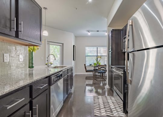 Dining Room With Kitchen View at Legacy Brooks, San Antonio, 78223