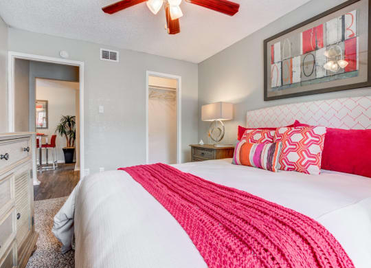 a bedroom with a bed and a ceiling fan at Sundance and Sausalito Apartments, Texas, 77840