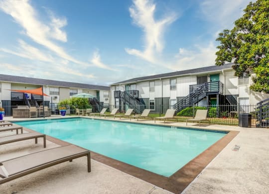 Swimming pool with relaxing sunbeds at The Wick, Texas