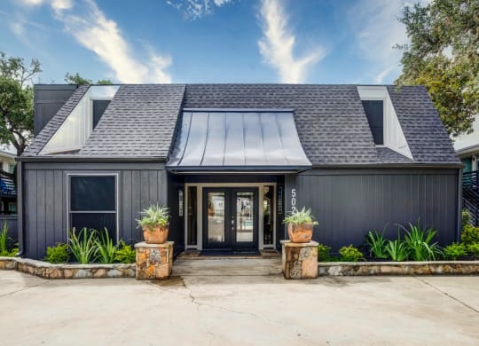 House with a black exterior and a gray roof  at Willowick Apartments, College Station, TX