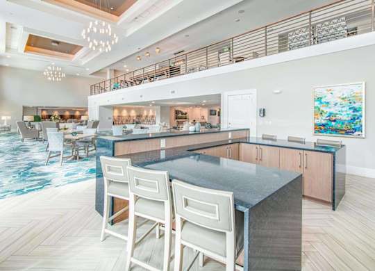 A modern kitchen with a dining table and chairs.