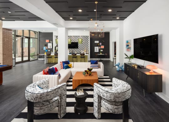 a living room with couches and a table and a television