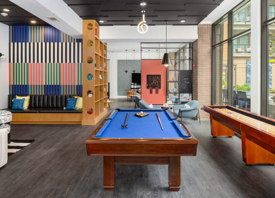 a game room with a pool table and a billiard table
