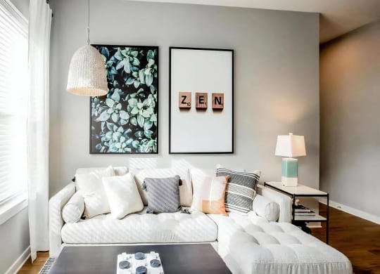 Cozy Living Room with Modern Sectional Sofa and Decorative Wall Art
