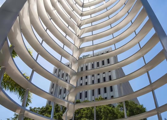 Artistic Metal Sculpture Outside Anchor Riverwalk with View of Downtown Landmark