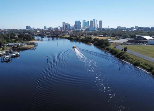 View of Downtown Tampa from the River with Water Taxi Near Anchor Riverwalk