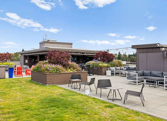 A patio area with a table and chairs.
