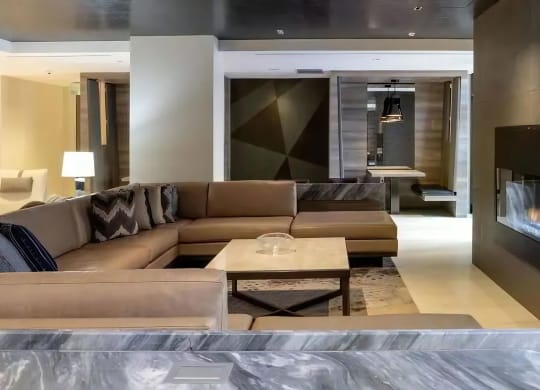 a living room with a fireplace and a couch and a table