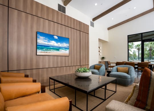 a living room with couches and chairs and a table